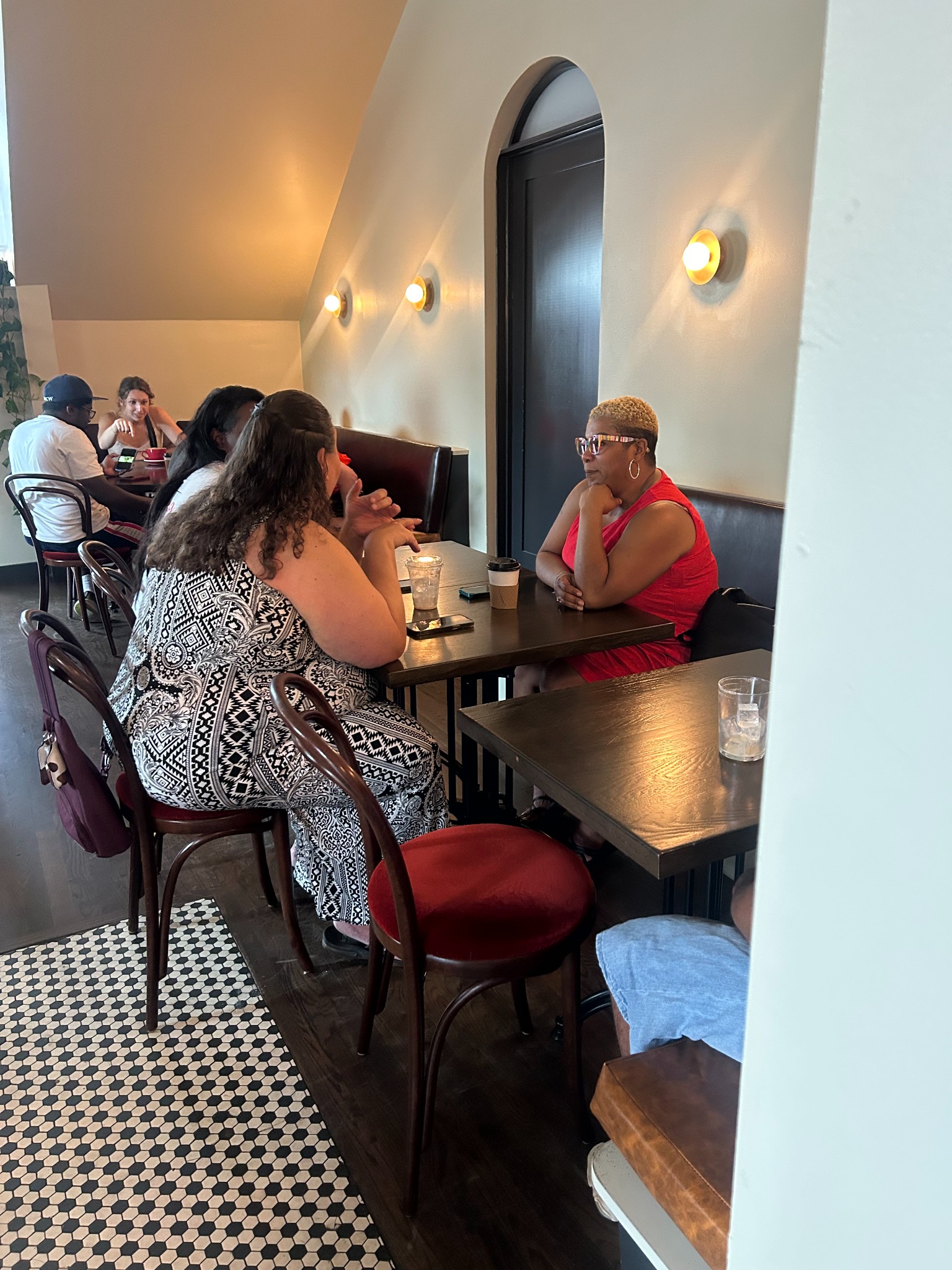 An intimate table conversation during Coffee and Conversations